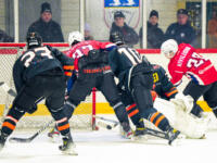20231017 Uusikaarlepyy, FINLAND. SUOMI-SARJA: MuIK Hockey Munsala - Järvenpään Haukat.
MuIK #28 Arttu Kiviluoma hits one behind Haukat #32 Roope Koskinen.
Photo: Samppa Toivonen / APOLLO PHOTO