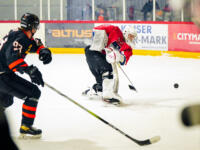 20231017 Uusikaarlepyy, FINLAND. SUOMI-SARJA: MuIK Hockey Munsala - Järvenpään Haukat.
MuIK #30 Patrik Koivisto clearing the puck near boards.
Photo: Samppa Toivonen / APOLLO PHOTO